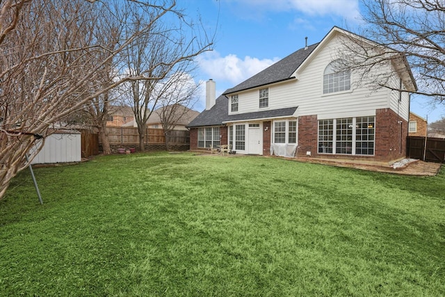 back of property with a storage shed and a lawn