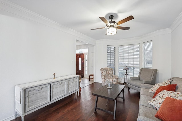 living room featuring ornamental molding, dark wood-type flooring, and ceiling fan