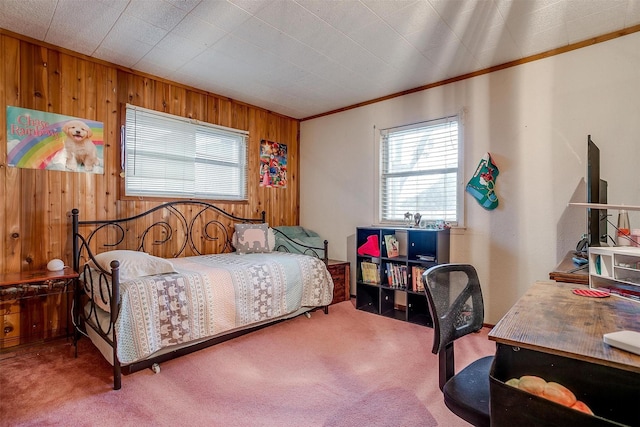 bedroom with wooden walls, ornamental molding, and carpet flooring