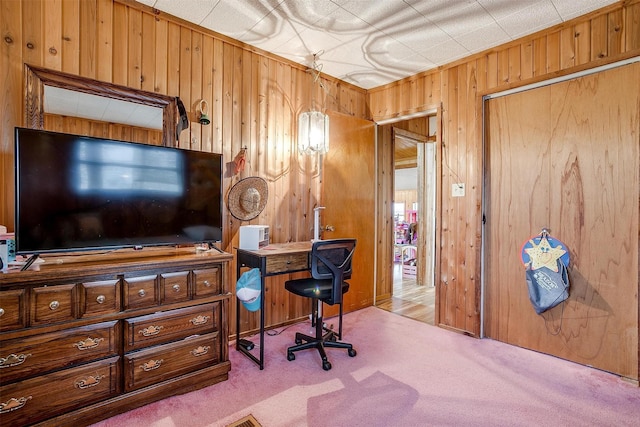 office with wooden walls and light colored carpet