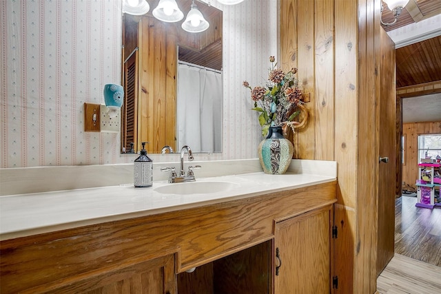 bathroom with vanity and hardwood / wood-style floors