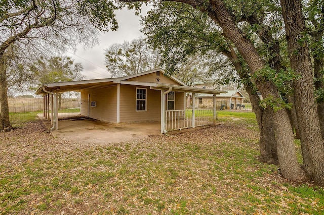 exterior space with a carport and covered porch