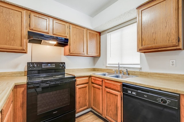 kitchen with sink and black appliances