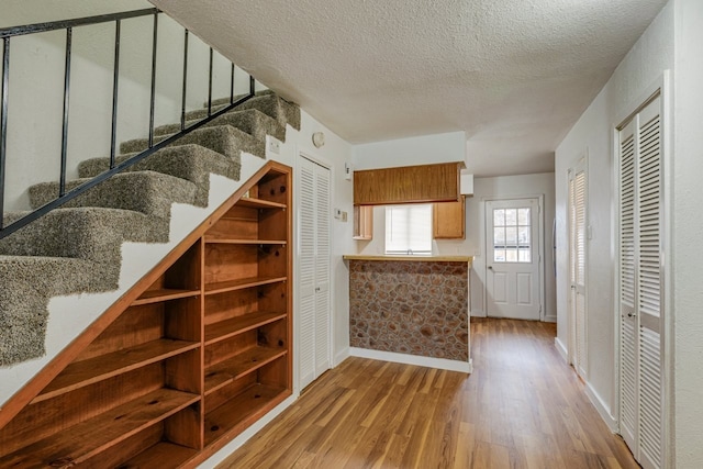 interior space featuring hardwood / wood-style floors and a textured ceiling