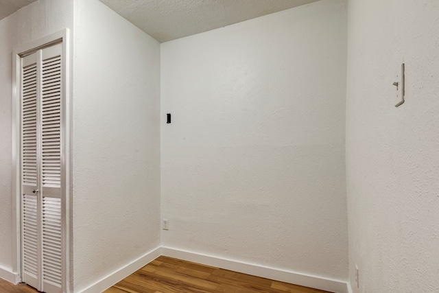 interior space featuring hardwood / wood-style floors and a textured ceiling