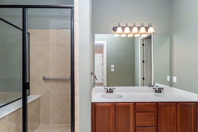 bathroom featuring vanity and a shower with shower door