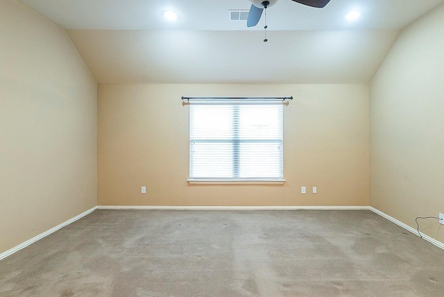 carpeted empty room with lofted ceiling and ceiling fan