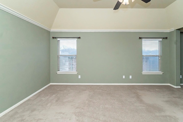 empty room with high vaulted ceiling, light colored carpet, and ceiling fan