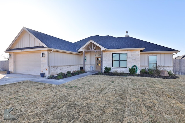 single story home with a garage and a front yard