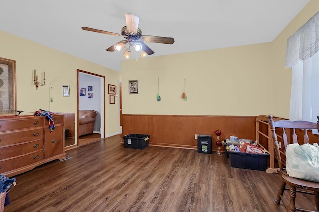 bedroom featuring ceiling fan and dark hardwood / wood-style floors