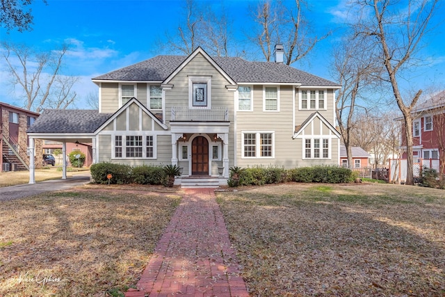 848 Robinson Pl, Shreveport, LA 71104 - view of front of property featuring a chimney, a carport, a shingled roof, and asphalt driveway