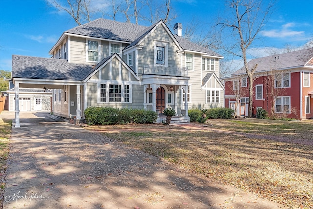 848 Robinson Pl, Shreveport, LA 71104 - view of front of house featuring asphalt driveway, a chimney, a porch, a carport, and a front lawn