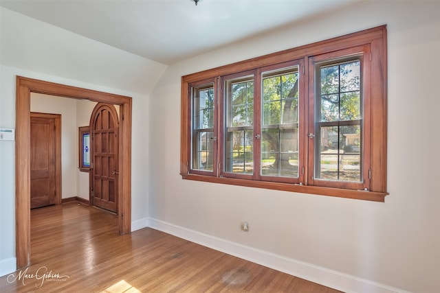848 Robinson Pl, Shreveport, LA 71104 - spare room featuring baseboards, wood finished floors, and vaulted ceiling