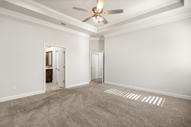 1476 Highland Park Cir, Granbury, TX 76048 - unfurnished bedroom with baseboards, a tray ceiling, crown molding, and visible vents