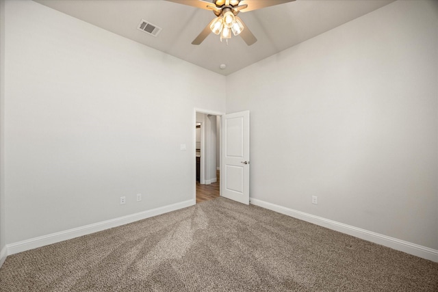 unfurnished room featuring ceiling fan and carpet flooring