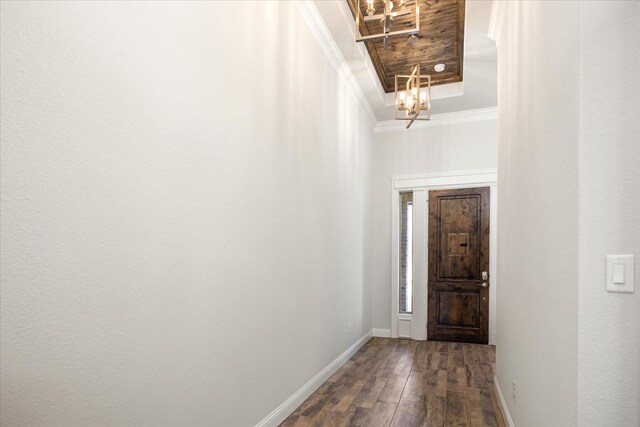 1476 Highland Park Cir, Granbury, TX 76048 - interior space featuring a tray ceiling, ornamental molding, dark wood-type flooring, baseboards, and a notable chandelier