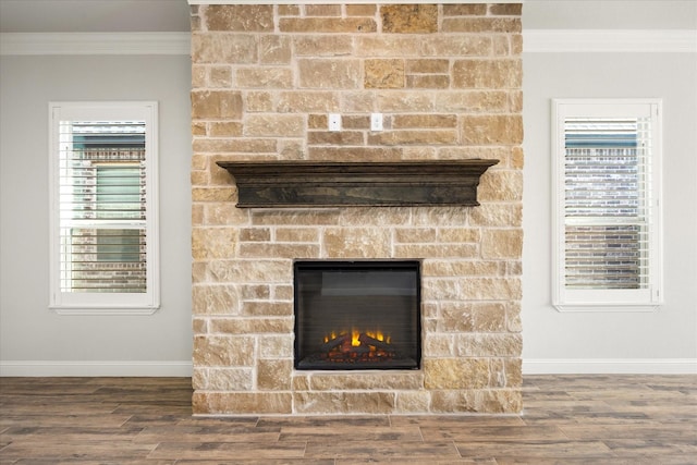 1476 Highland Park Cir, Granbury, TX 76048 - details featuring baseboards, wood finished floors, crown molding, and a stone fireplace