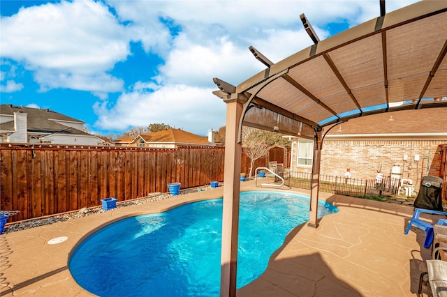 view of pool with a pergola and a patio