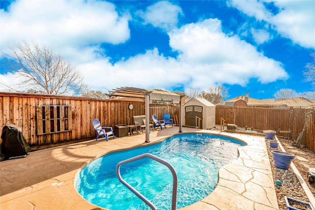 view of pool featuring a storage shed and a patio area