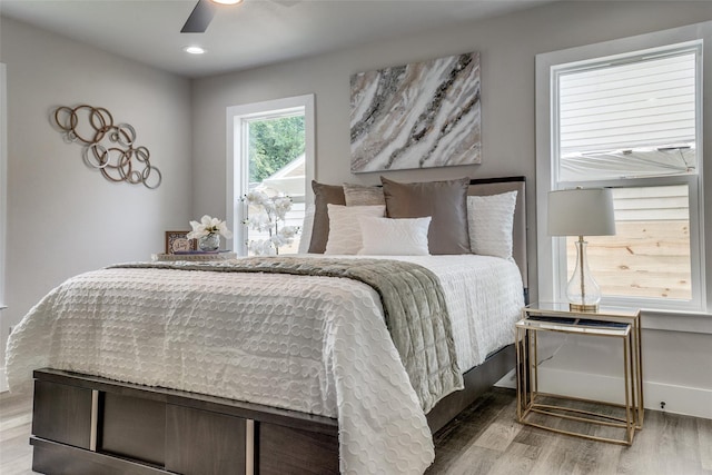 bedroom featuring ceiling fan and light hardwood / wood-style floors