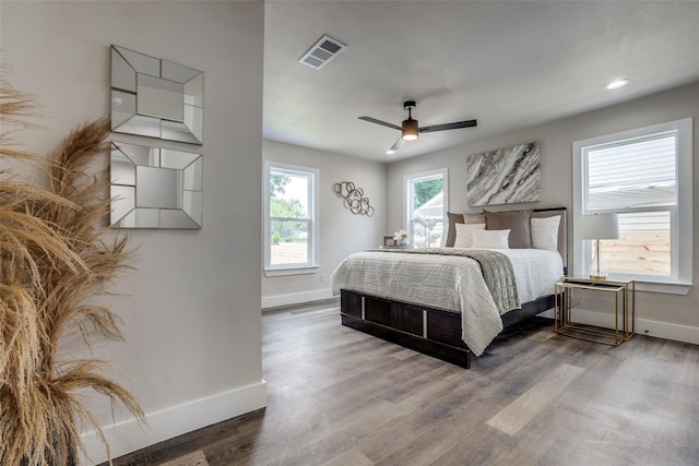 bedroom with hardwood / wood-style flooring and ceiling fan