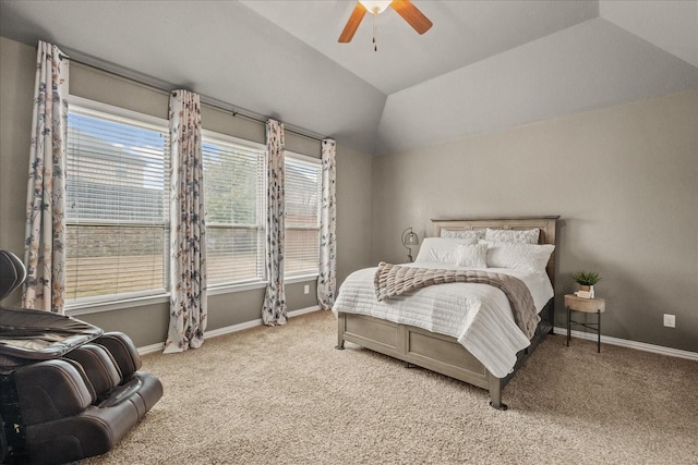 bedroom featuring vaulted ceiling, light carpet, and ceiling fan