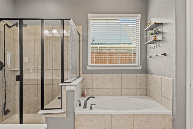 bathroom with shower with separate bathtub