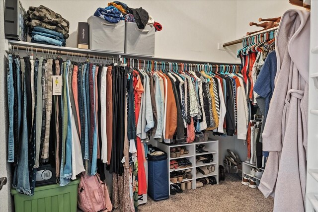 clothes washing area featuring light parquet flooring and washer and dryer