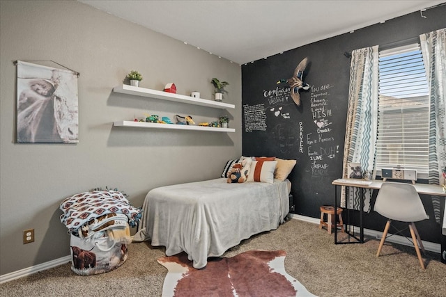 bedroom with baseboards and carpet floors