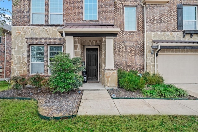 entrance to property featuring a garage