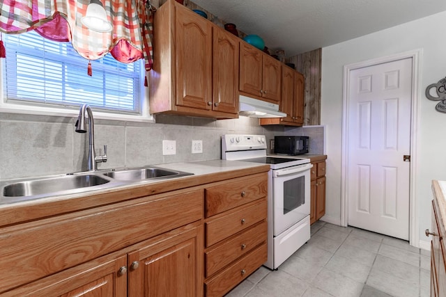 kitchen featuring white range with electric cooktop, sink, decorative backsplash, and light tile patterned floors