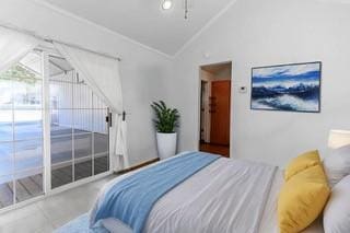 bedroom featuring lofted ceiling