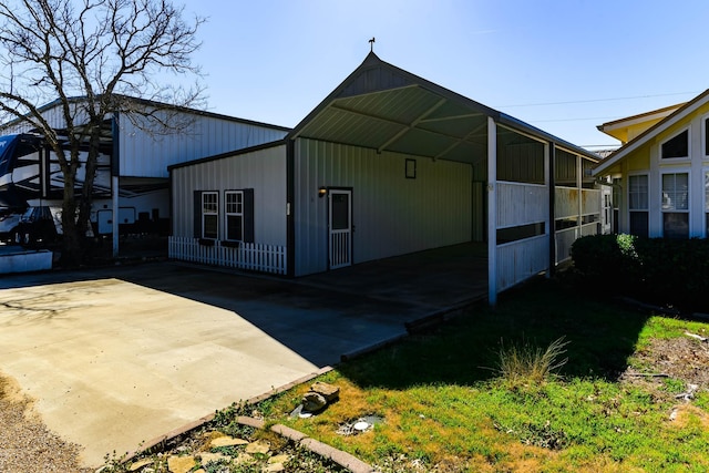 view of outbuilding featuring a carport