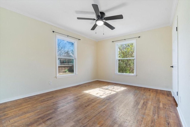 unfurnished room with crown molding, wood-type flooring, and ceiling fan