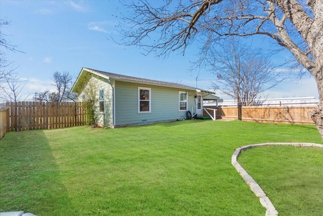 back of house featuring a yard