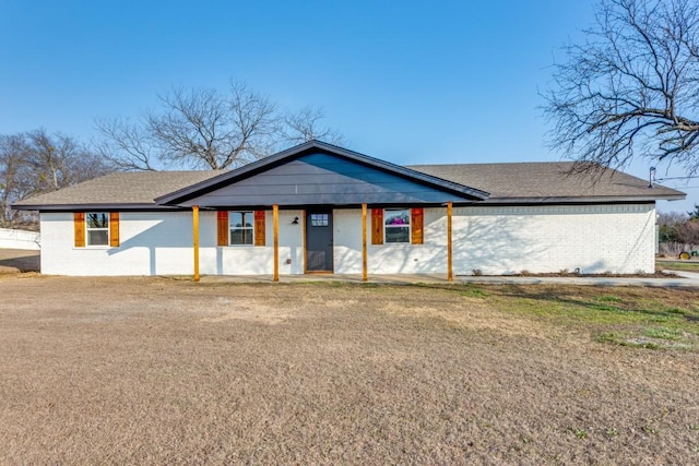 ranch-style home with a front lawn