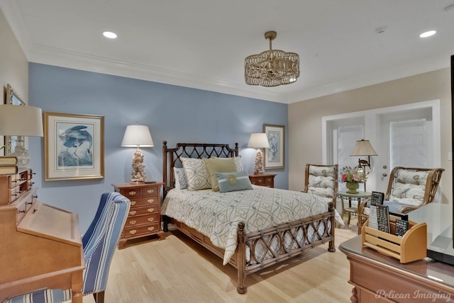 bedroom featuring ornamental molding and wood-type flooring