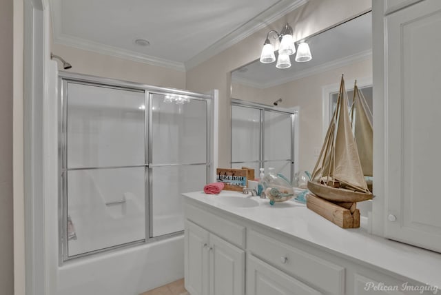 bathroom featuring vanity, bath / shower combo with glass door, and ornamental molding