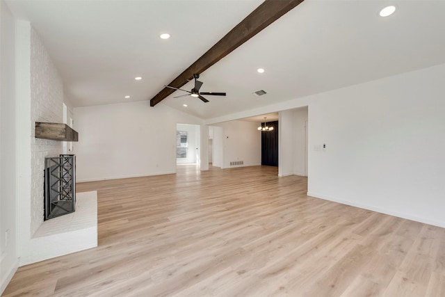 unfurnished living room with a fireplace, ceiling fan with notable chandelier, light hardwood / wood-style flooring, and vaulted ceiling with beams