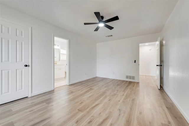 unfurnished bedroom featuring ceiling fan, connected bathroom, and light wood-type flooring