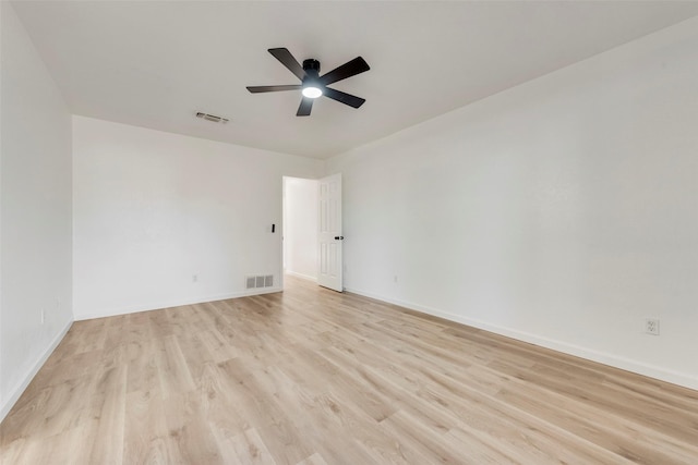 spare room featuring ceiling fan and light hardwood / wood-style floors