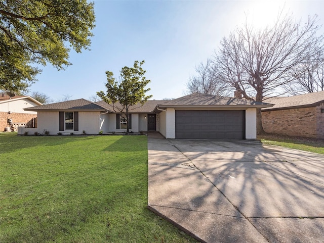 ranch-style house with a garage and a front lawn