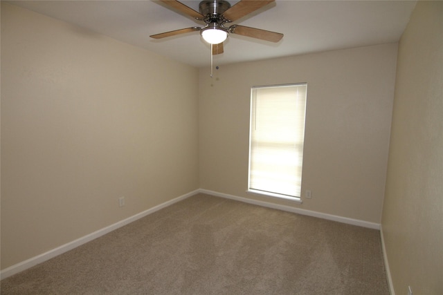 carpeted empty room with ceiling fan