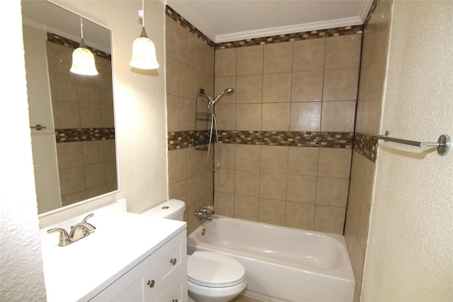 full bathroom with vanity, crown molding, toilet, and tiled shower / bath combo