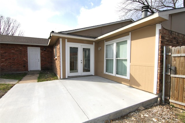 back of property featuring a patio and french doors