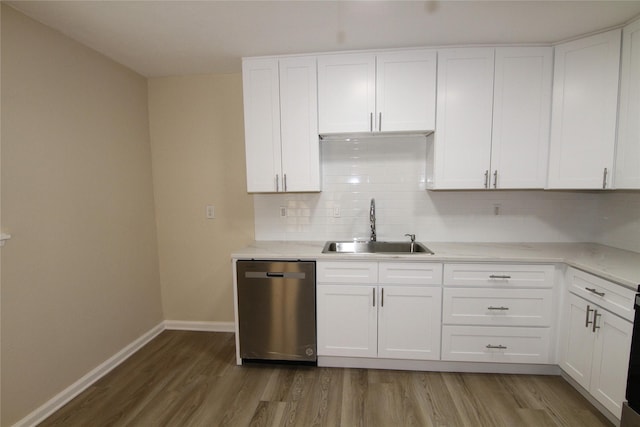 kitchen with white cabinetry, sink, hardwood / wood-style flooring, and dishwasher