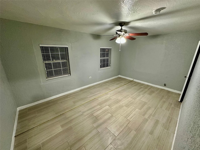 unfurnished bedroom with ceiling fan, light hardwood / wood-style floors, and a textured ceiling