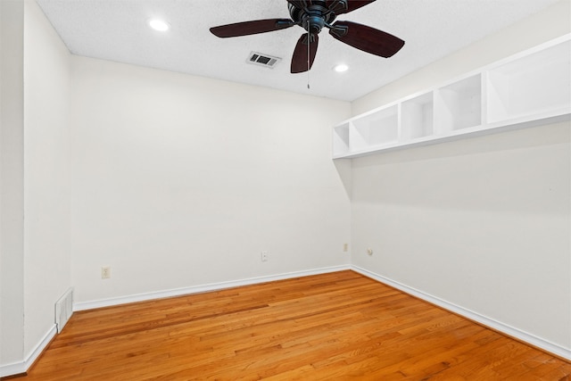 unfurnished room featuring hardwood / wood-style floors and ceiling fan