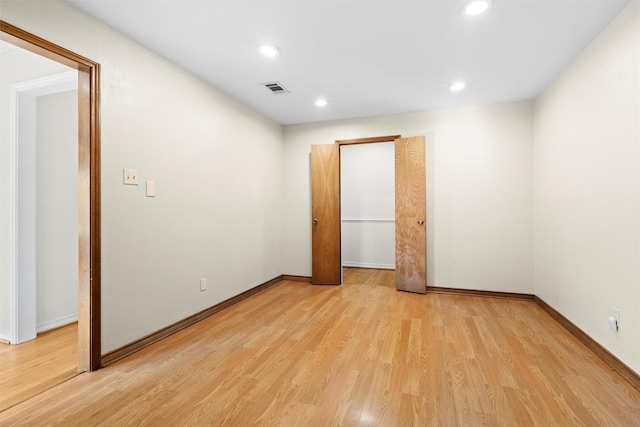 unfurnished bedroom featuring light wood-type flooring