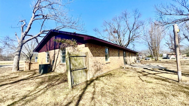 view of property exterior with central AC